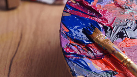 Artist's palette with mixed paints and brush, closeupの写真素材