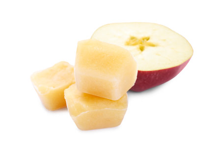 Frozen apple puree cubes and fruit on white backgroundの写真素材