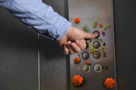 Man press button in elevator with germs, closeup