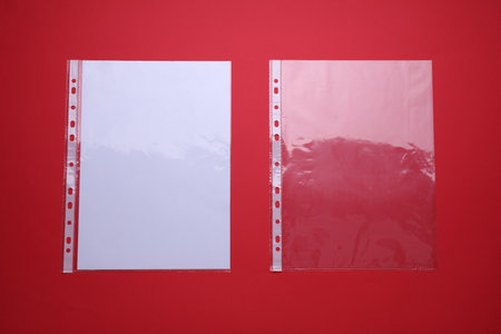 Punched pockets on red background, flat layの写真素材