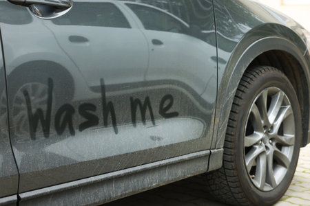 Phrase Wash Me written on dirty car, closeupの写真素材