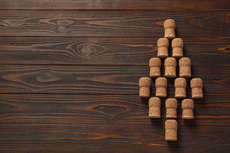 Christmas tree made of wine corks on wooden table, top view. Space for textの写真素材