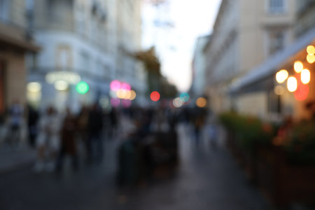 Blurred view of people walking on city streetの写真素材