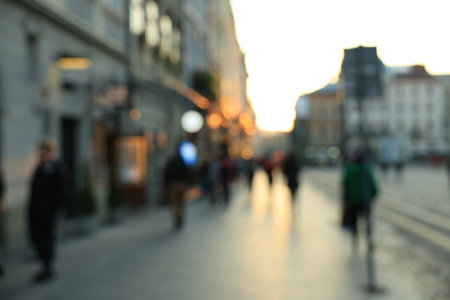 Blurred view of people walking on city streetの写真素材