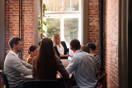 Businesswoman having a meeting with her employees in office. lady bossの写真素材