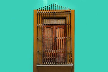 Exterior of building with beautiful window and steel grillesの写真素材