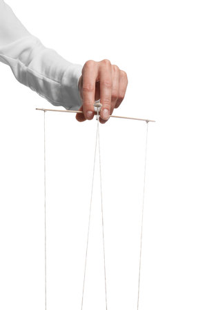 Woman pulling strings of puppet on white background, closeup