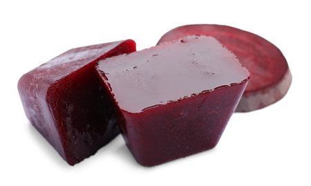 Frozen beetroot puree cubes and fresh beetroot isolated on whiteの写真素材