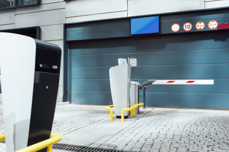 Parking meters on city street near buildingsの写真素材