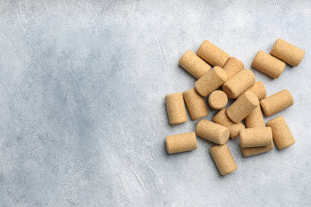 Wine bottle corks on light gray table, flat lay. Space for textの写真素材