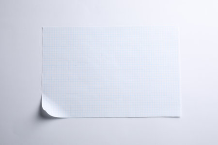 Checkered sheet of paper on white background, top viewの写真素材