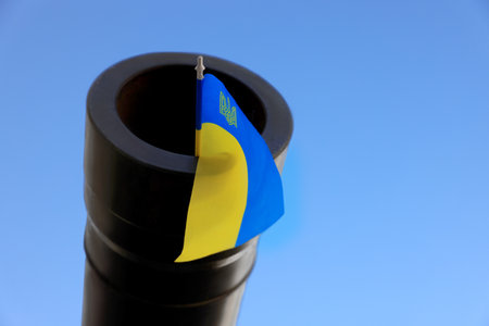 Ukrainian flag in muzzle of tank outdoorsの写真素材