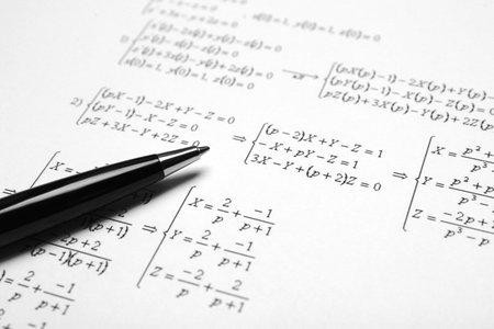 Sheet of paper with mathematical formulas and pen, closeupの写真素材