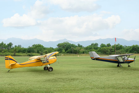 View of beautiful ultralight airplanes in the field on autumn day