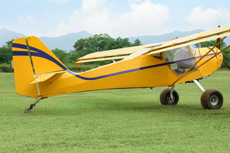 View of beautiful ultralight airplane in the field on autumn day