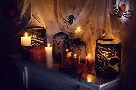 Different Halloween decor on fireplace indoors. Festive interiorの写真素材