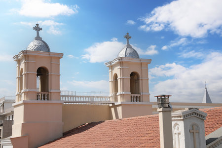 Beautiful church with red roof against blue skyの写真素材