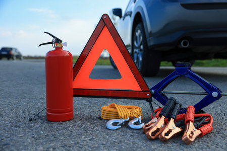 Emergency warning triangle and car safety equipment outdoorsの写真素材
