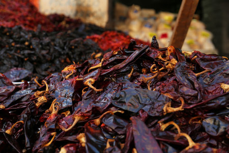 Heap of dried Serrano peppers on counter at market, closeup. Space for text