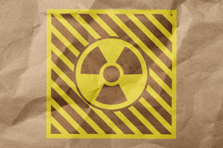 Radioactive sign on crumpled craft paper. Hazard symbolの写真素材