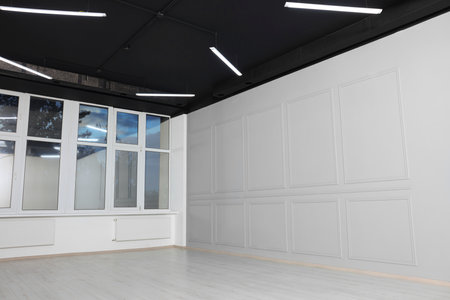 Beautiful window in spacious room during repairの写真素材