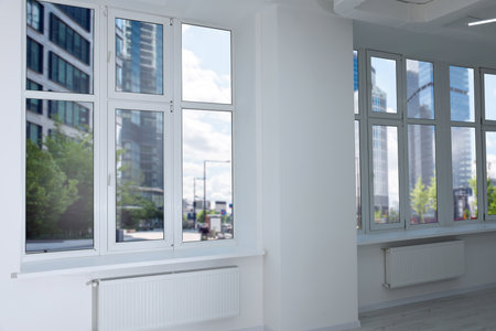 New empty room with clean windows and white wall