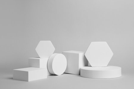 scene for product presentation. Podiums of different geometric shapes on light gray background
