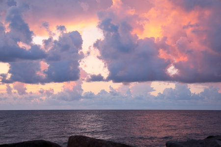 Picturesque view of sky with heavy rainy clouds over seaの写真素材