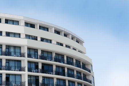 Exterior of beautiful residential building against blue skyのeditorial素材