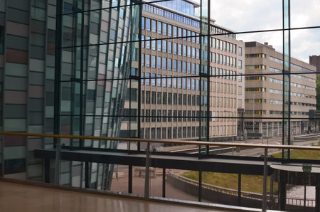 Beautiful city street with buildings, view through big glass windows