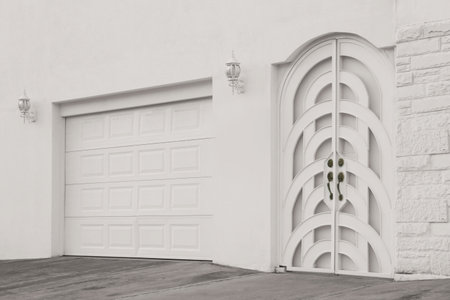 Entrance of house with beautiful arched doors and gatesの写真素材