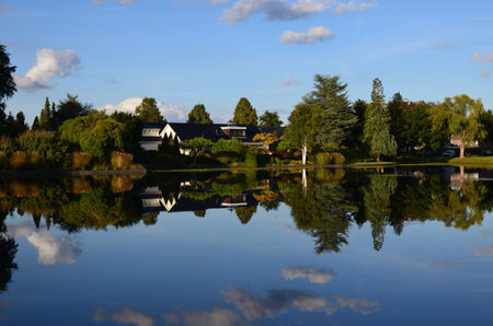 picturesque view of pond and beautiful estateの写真素材