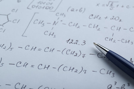 Sheet of paper with different chemical formulas and pen, closeupの写真素材