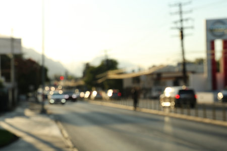 Blurred view of road with cars, bokeh effect