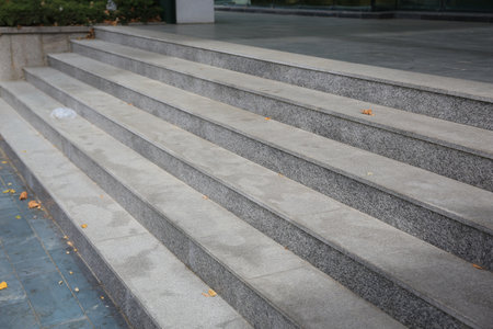 View of empty gray tile staircase outdoors