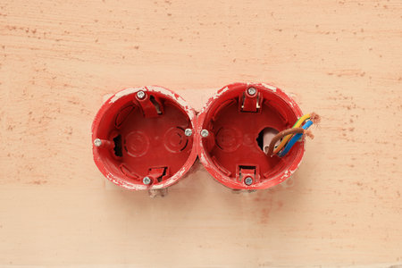 Mounting boxes with wires on wall, closeup