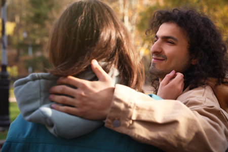 Happy young couple spending time together outdoors. dating agencyの写真素材