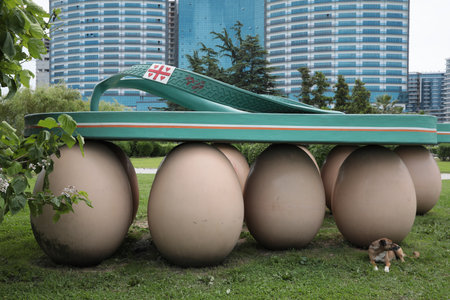 Batumi, Georgia - June 24, 2022: Dog near beautiful art installation Sea Slippers on Eggsのeditorial素材