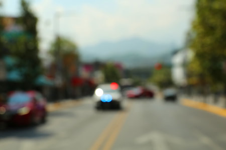 Blurred view of city street with carsの写真素材