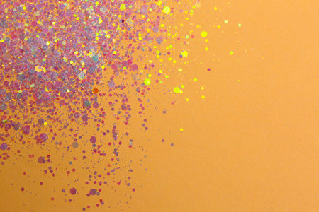 Shiny bright lilac glitter on beige background, flat lay. Space for textの写真素材