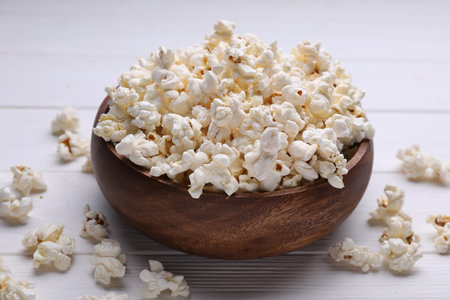 Tasty popcorn on white wooden table, closeupの写真素材