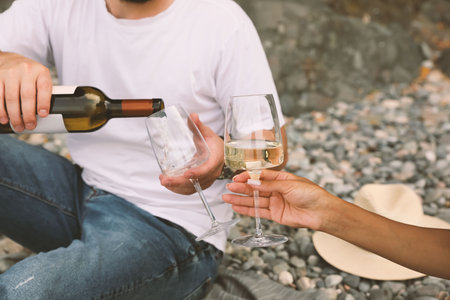 Young couple having picnic on the beach, closeupの写真素材