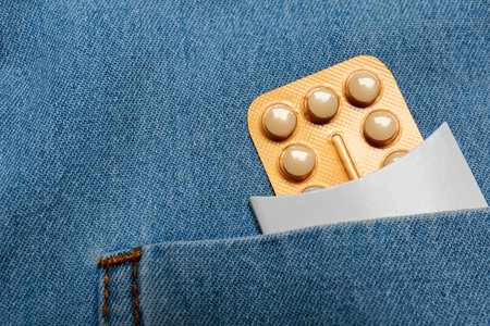 Birth control pills in pocket of jeans, closeupの写真素材