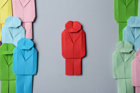 Many colorful paper figures on gray background, flat lay. Recruiter searching employeeの写真素材