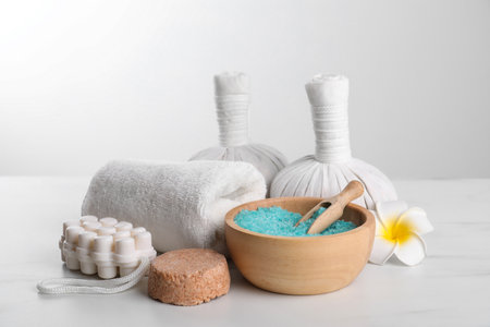 Spa composition with care products on white marble tableの写真素材