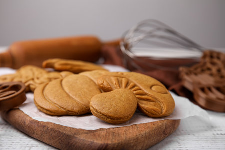 Tasty cookies and cutters on white wooden table, closeupの写真素材