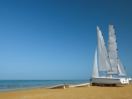 Seacoast with modern boats on sunny dayの写真素材