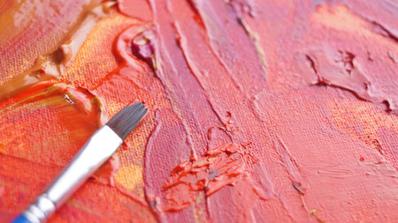 Brush on artist's palette with mixed paints, closeup. Space for textの写真素材