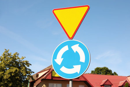 Different road signs on city street. traffic rules