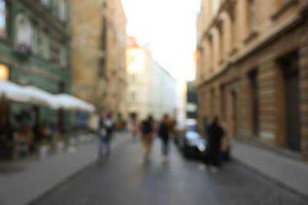 Blurred view of people walking on city streetの写真素材